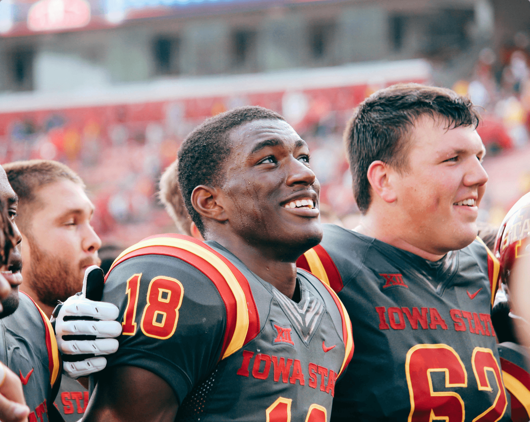 The Iowa State football program is standing next to each other on game day Iowa State University football players in the stadium.
